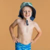 Chapeau Anti UV Bébé Réversible Bleu Et Imprimé Palmiers -Kitesurf Boutique chapeau anti uv bebe reversible bleu et imprime palmiers